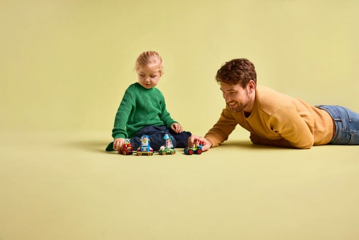 Конструктор LEGO Disney Pixar Святкування з Історії Іграшок: потяг і авто для перегонів