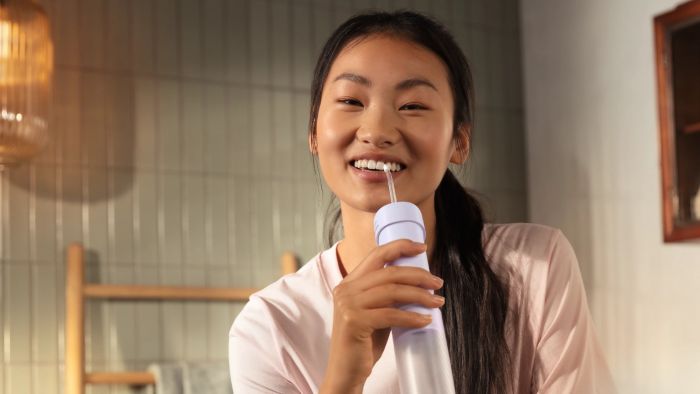 Іригатор Philips портативний Sonicare Compact Flosser 1000, чаша 200 мл, складний, фіолетовий